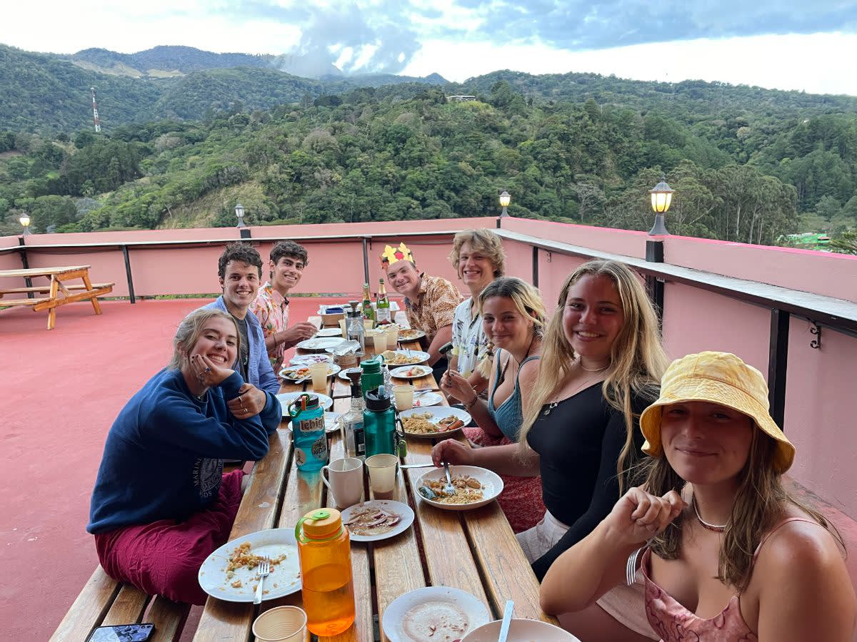 Students eating Lunch on Roof overlooking Jungle