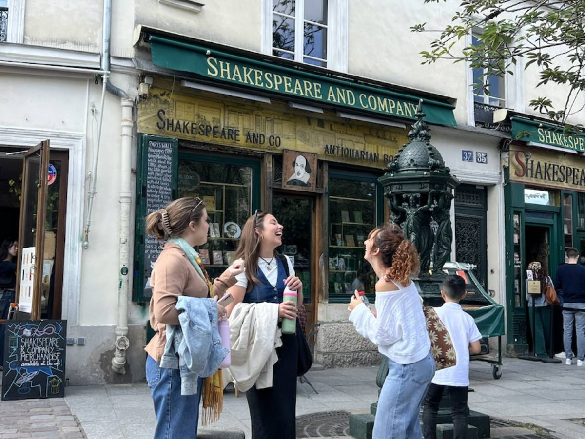students laughing outside book shop