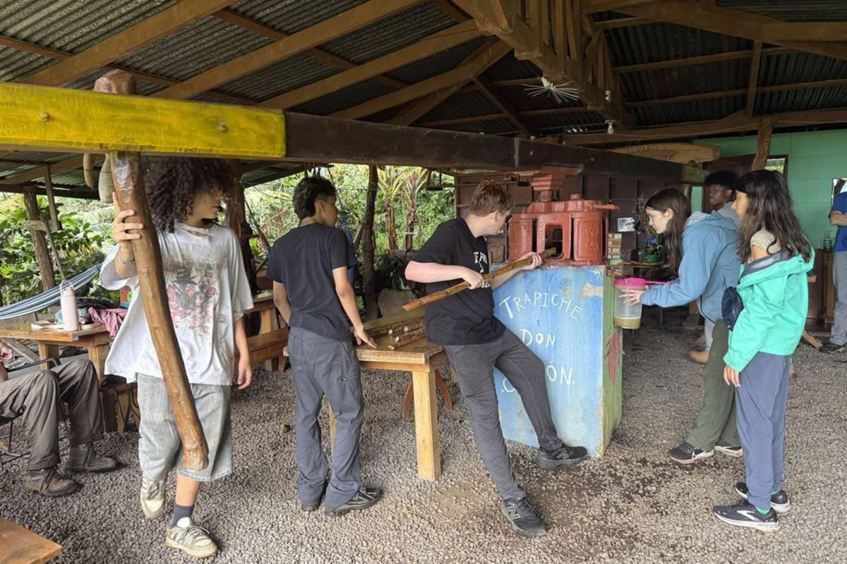 Students making sugar cane in Monteverde
