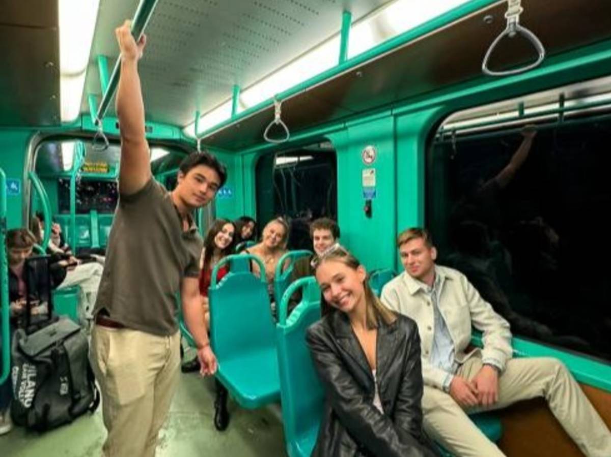Students navigate Milanese public transit.