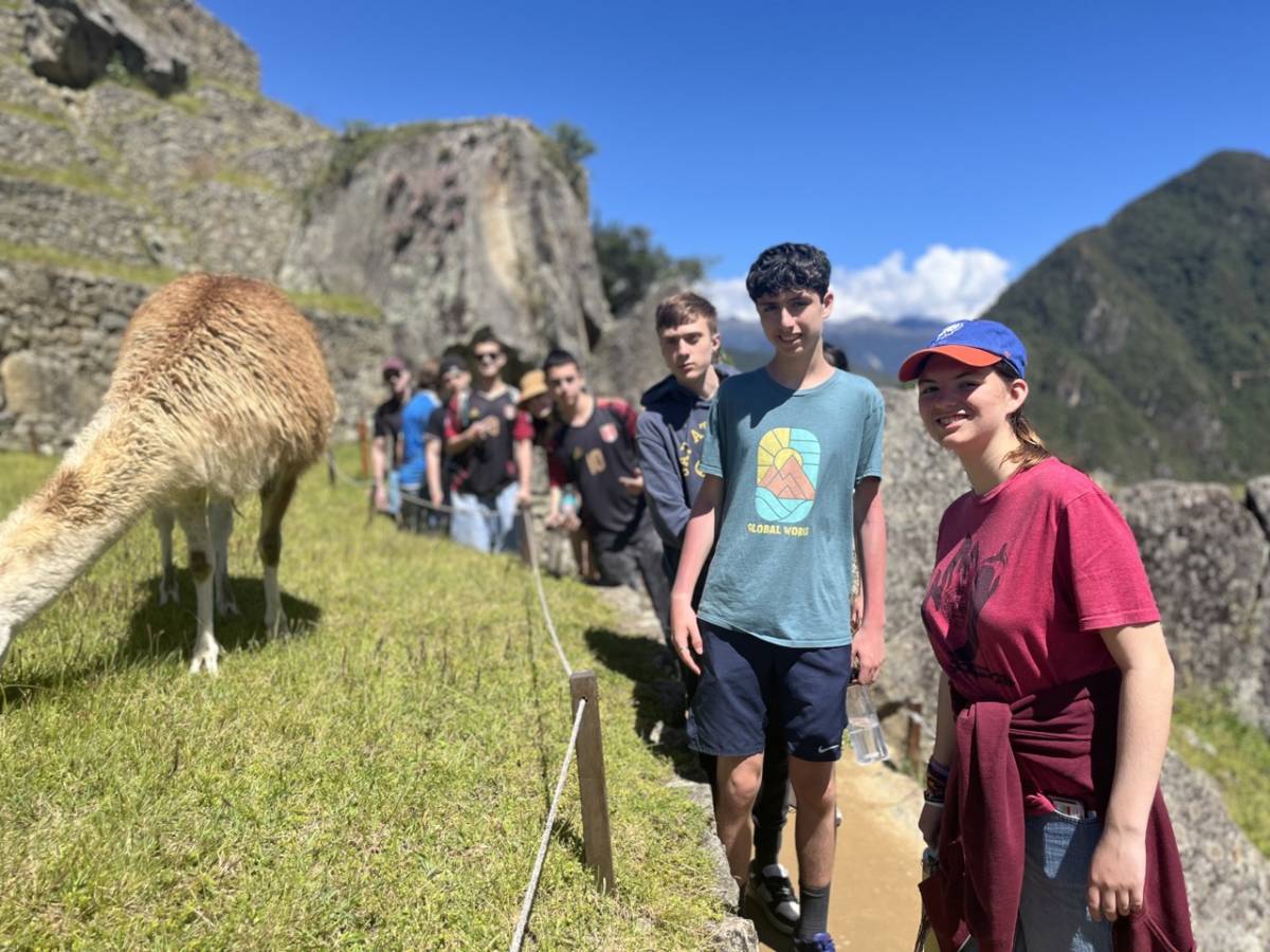 Students on a Peru Travel Program with a llama
