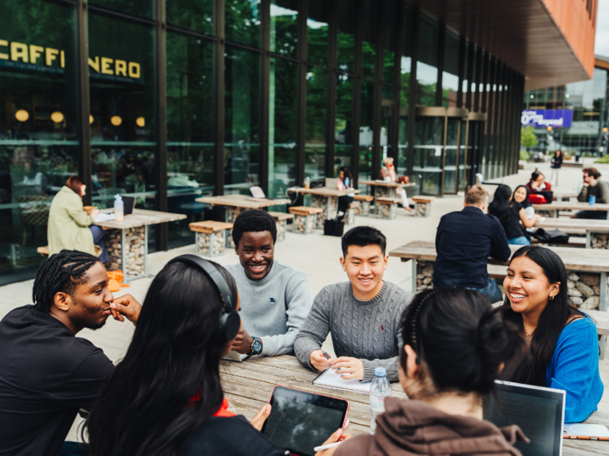 Students outside a cafe studying