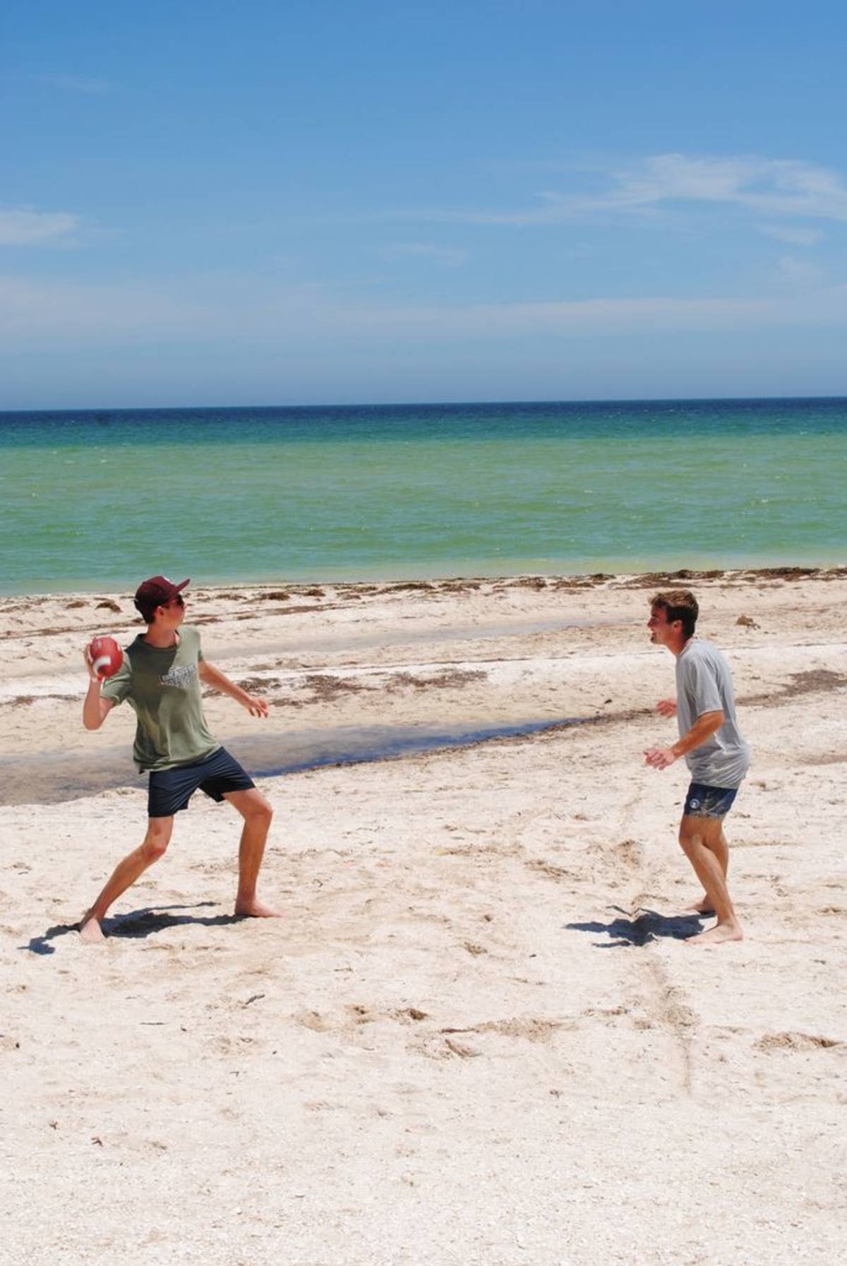Students playing football on the beach in Yucatan