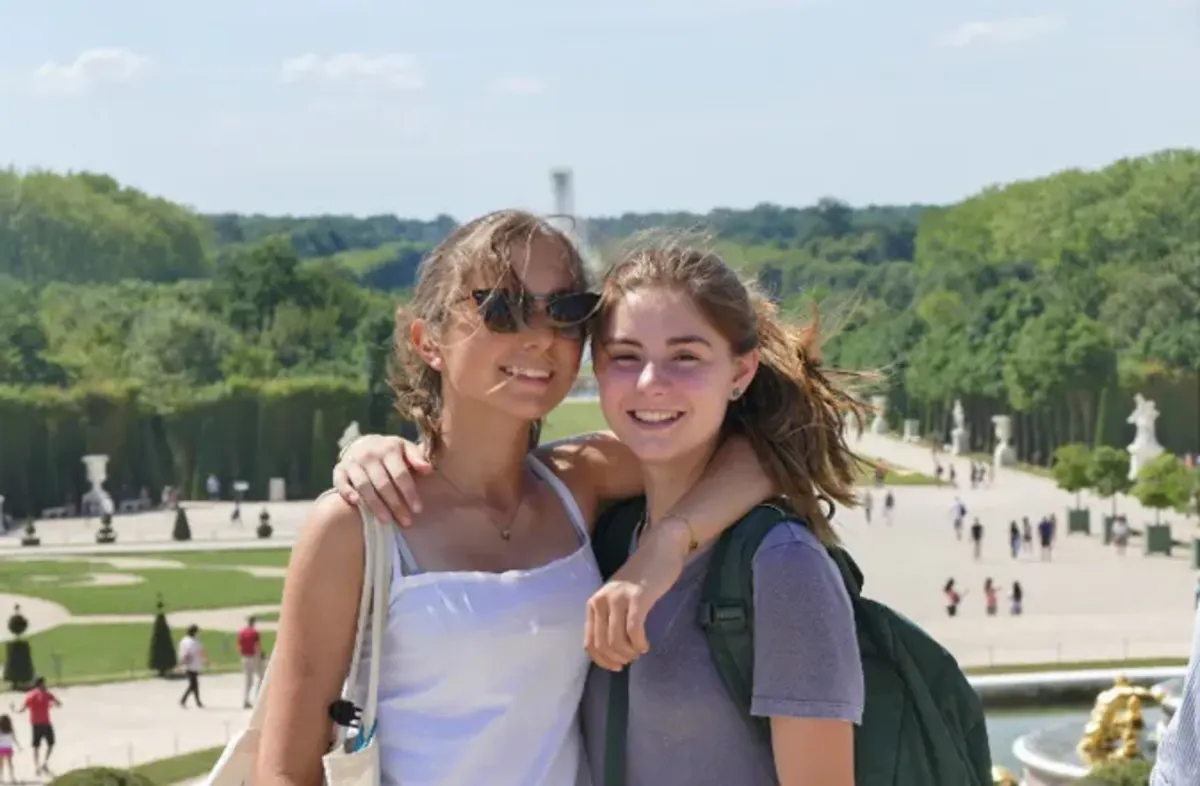 Students pose for a photo in the gardens in france