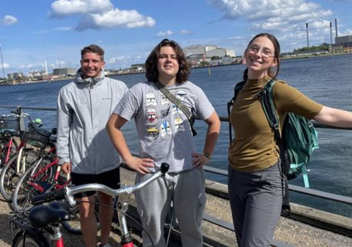 Students posing by bikes in Copenhagen