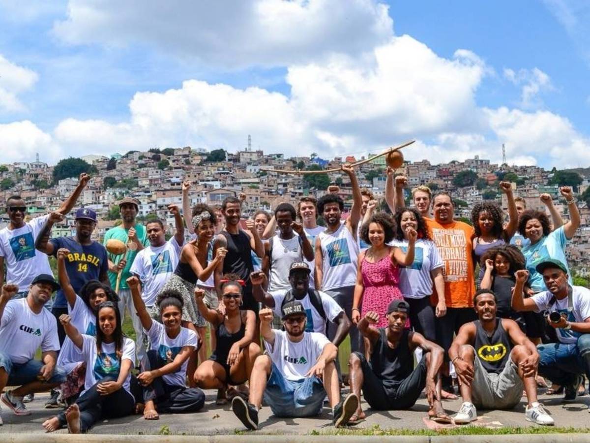 Students raising their fists with a local group