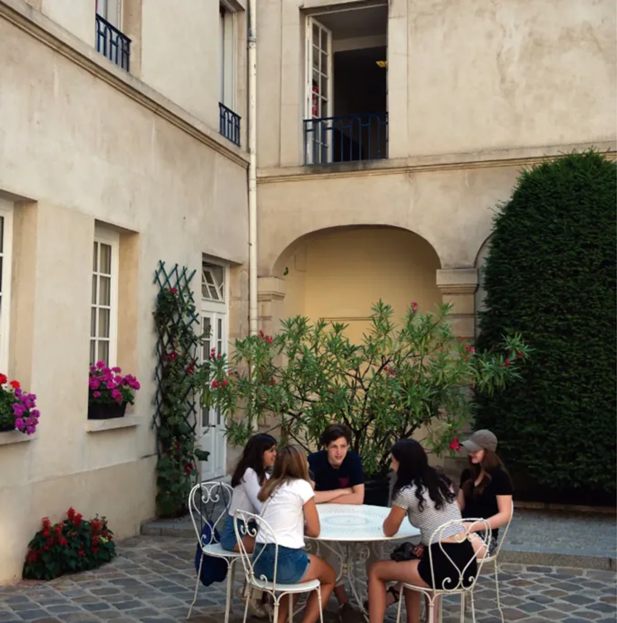Students sit in a group in France