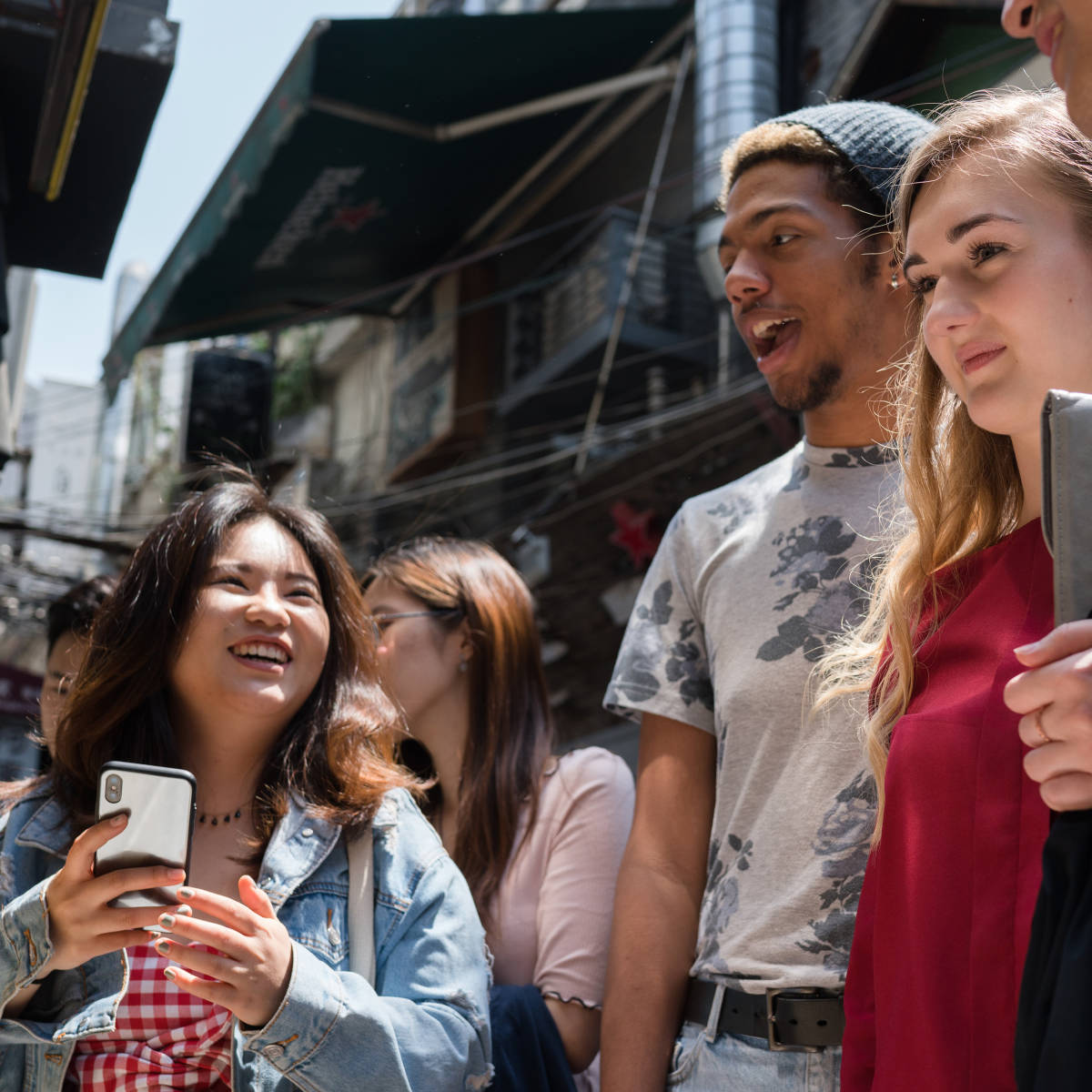 Students smile in the city.
