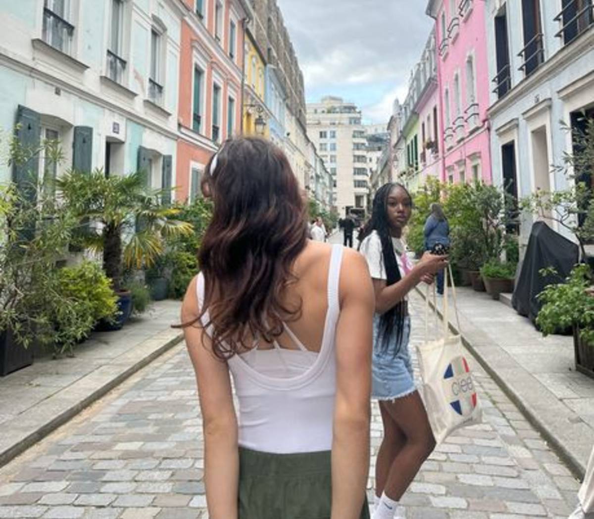 Students strolling down a colorful avenue in Paris