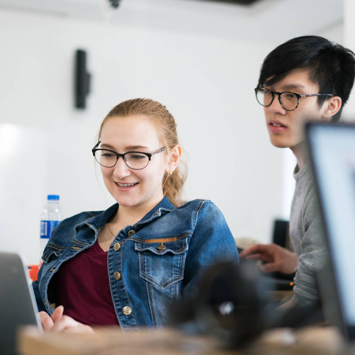 Students study at a laptop.