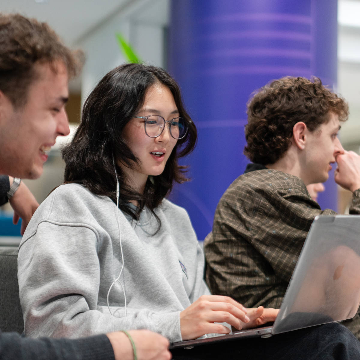 Students study on laptop.