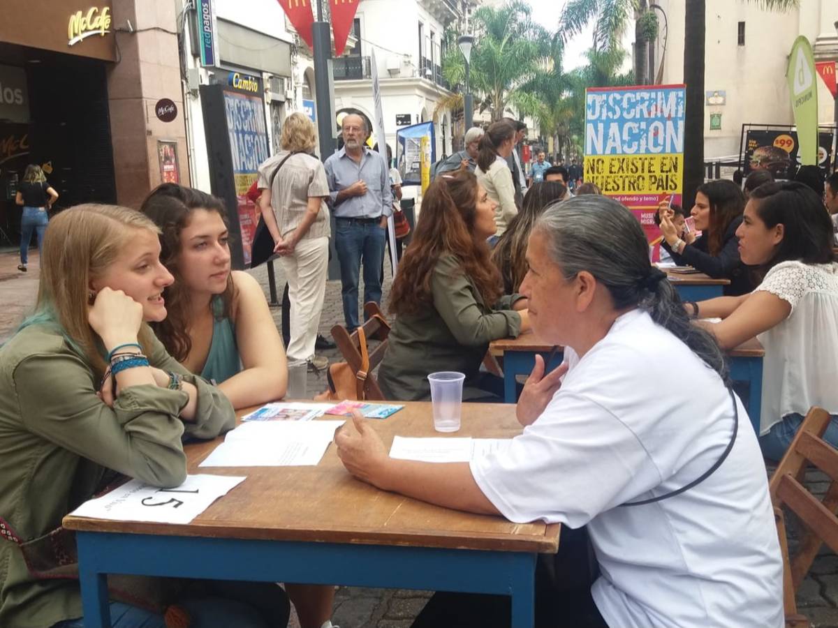 Students talking at a table as part of an event