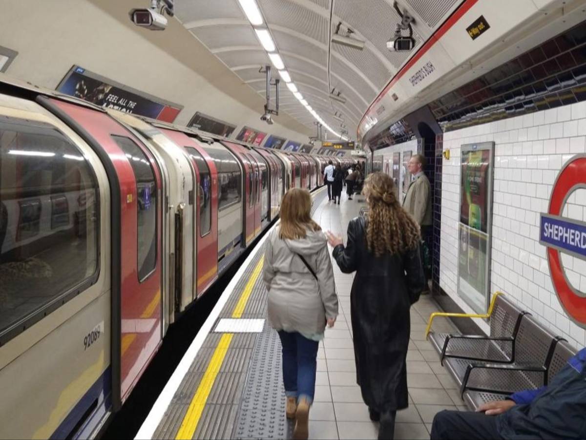 Students walk along the platform at Shepherd’s Bush Underground station in London.