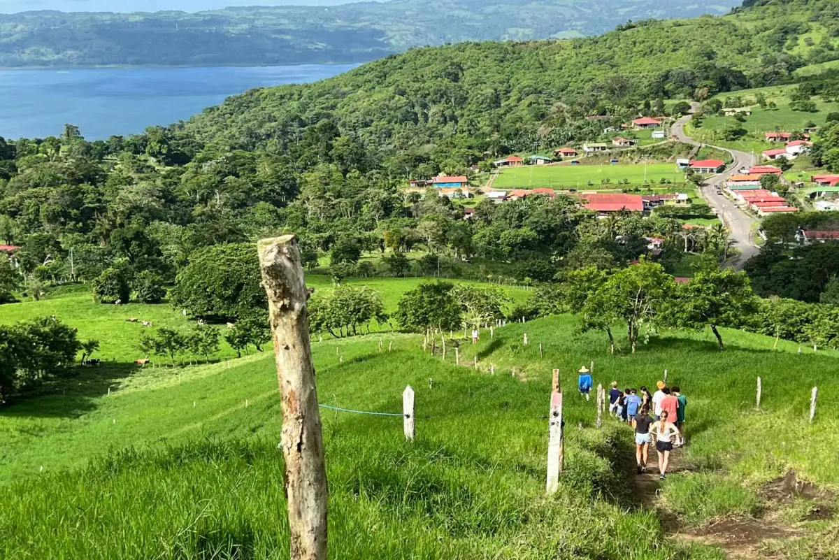 Students walk into village
