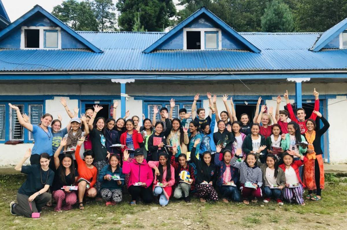 students waving