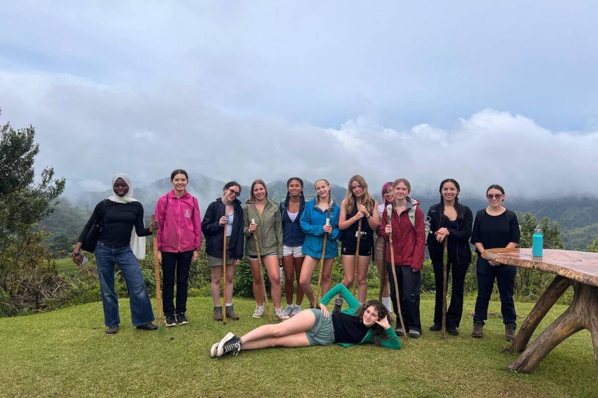 Students with walking sticks on a hike in Monteverde