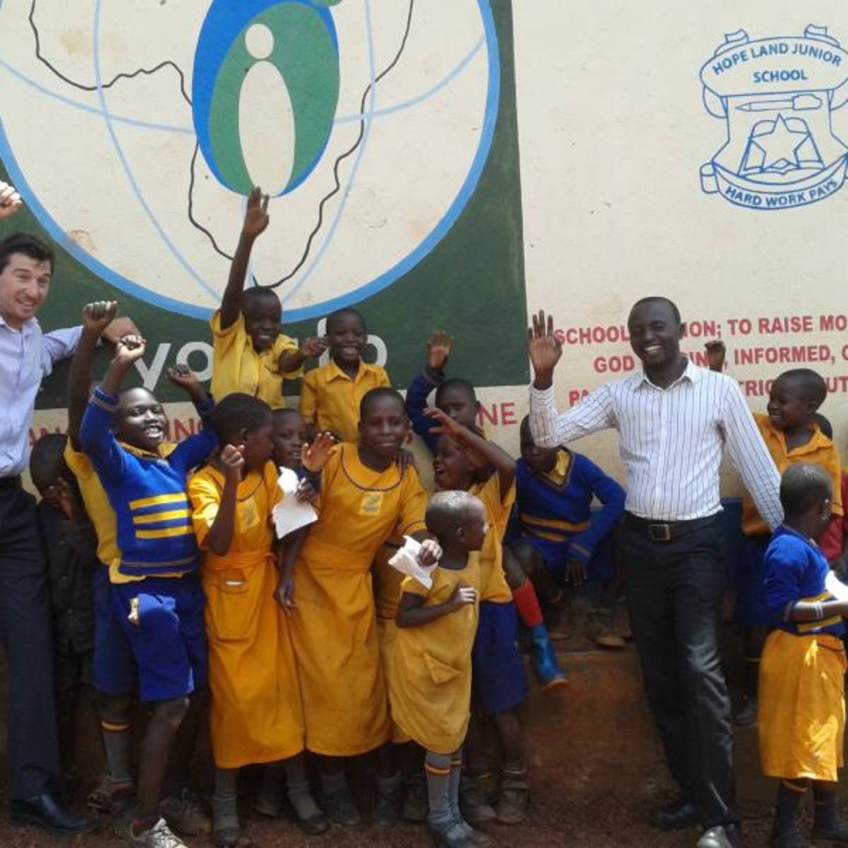 Volunteer with his students in rural Uganda, Africa