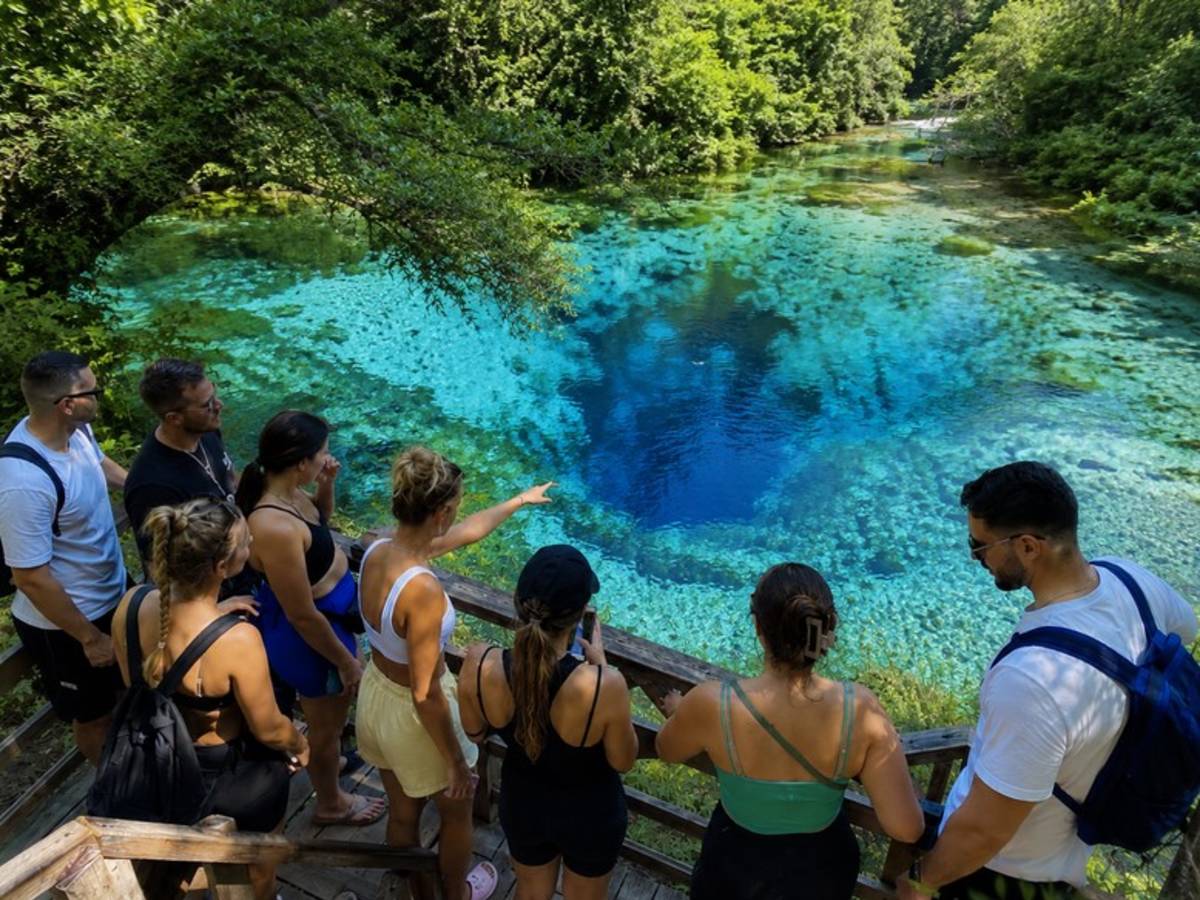 Travellers overlooking the Blue Eye spring in Albania