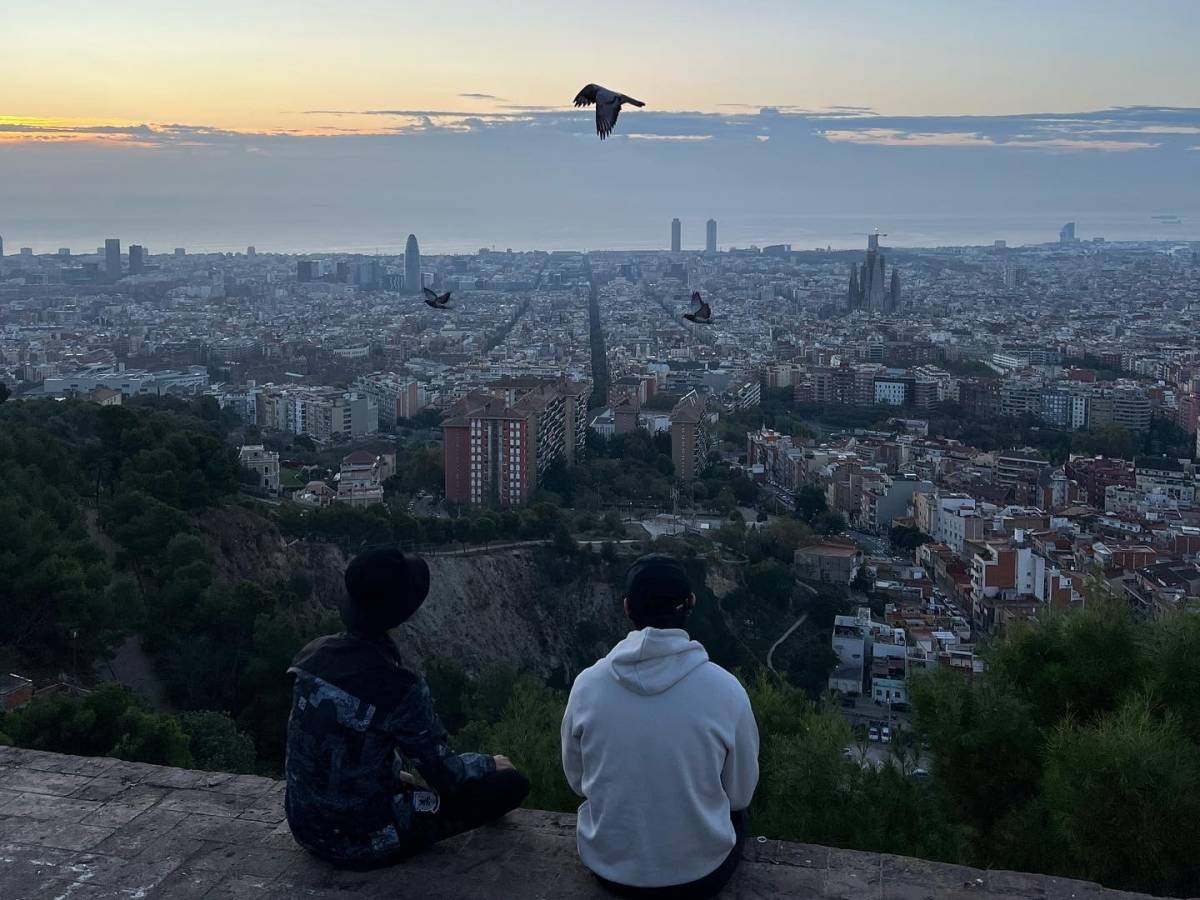 Two interns sitting on top of a roof in Barcelona, Spain!