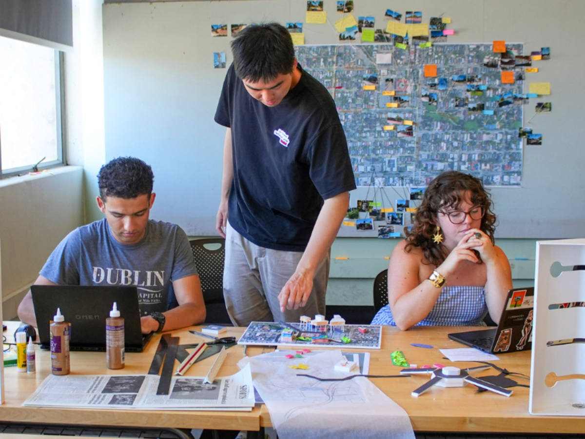Two students and instructor in studio