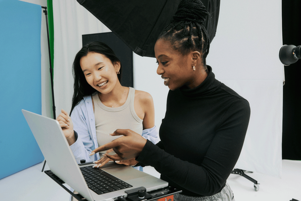 Two students in a studio collaborating on a photo shoot