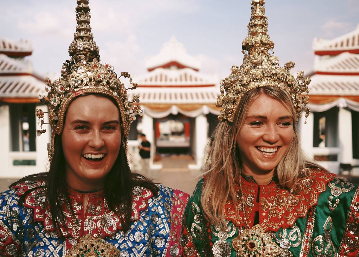 Two women wearing traditional Thai garments