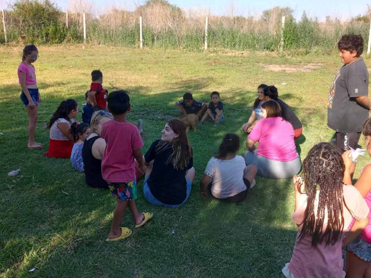 Volunteer playing with children