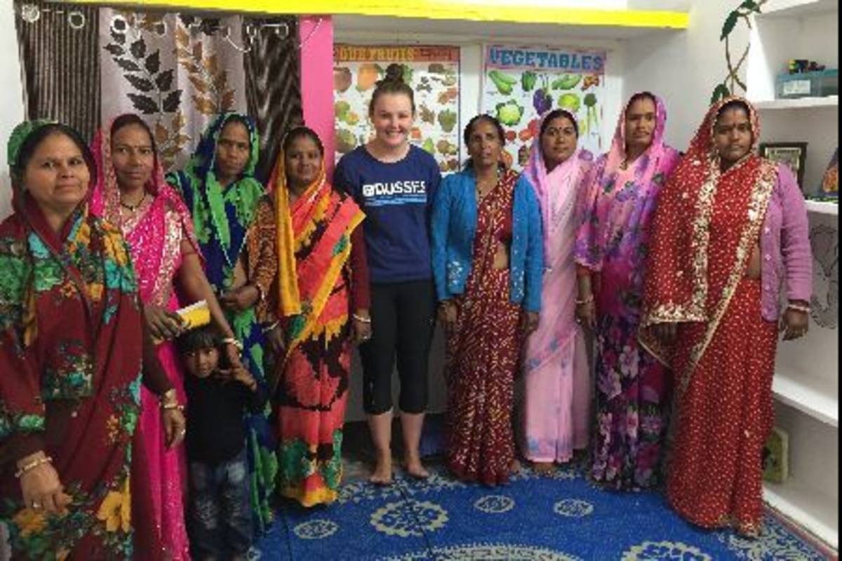 Volunteer with group of women