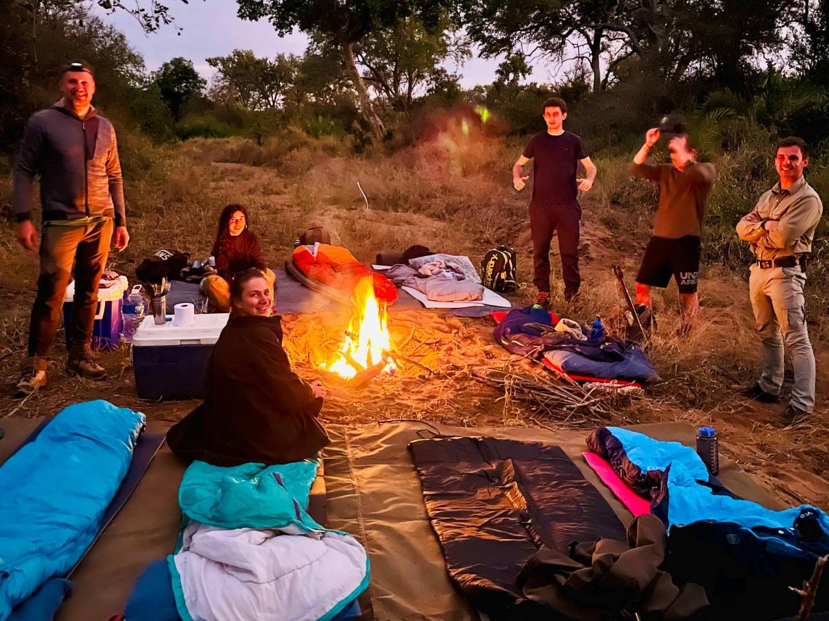 Volunteers around a campfire