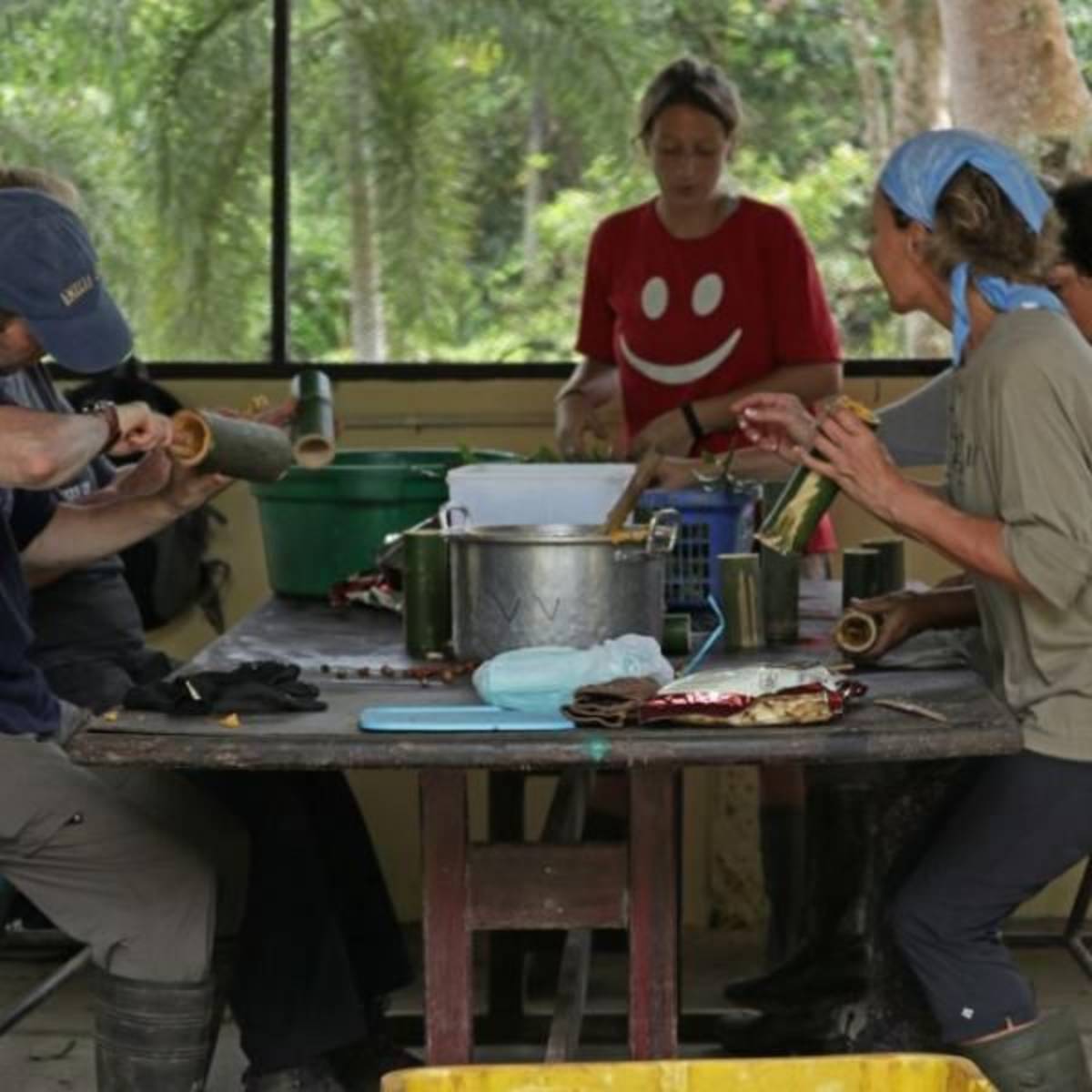 Volunteers creating enrichment for the orangutans