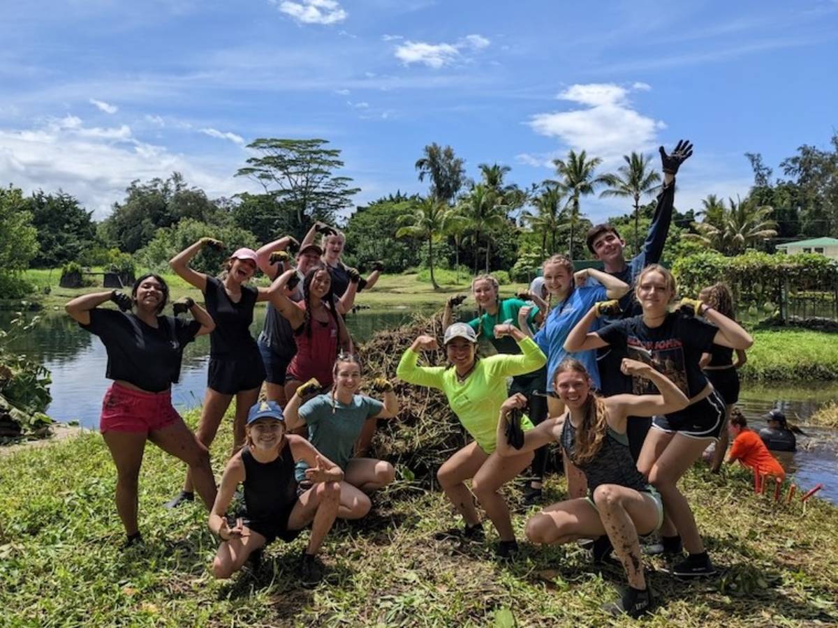 Volunteers posing in Hawaii after working on local project on farm