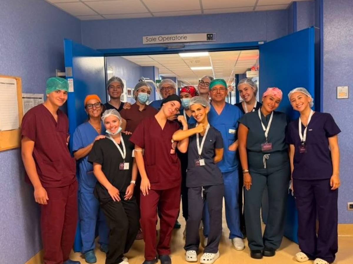 11 students from the program posing with the OR team in Bari.