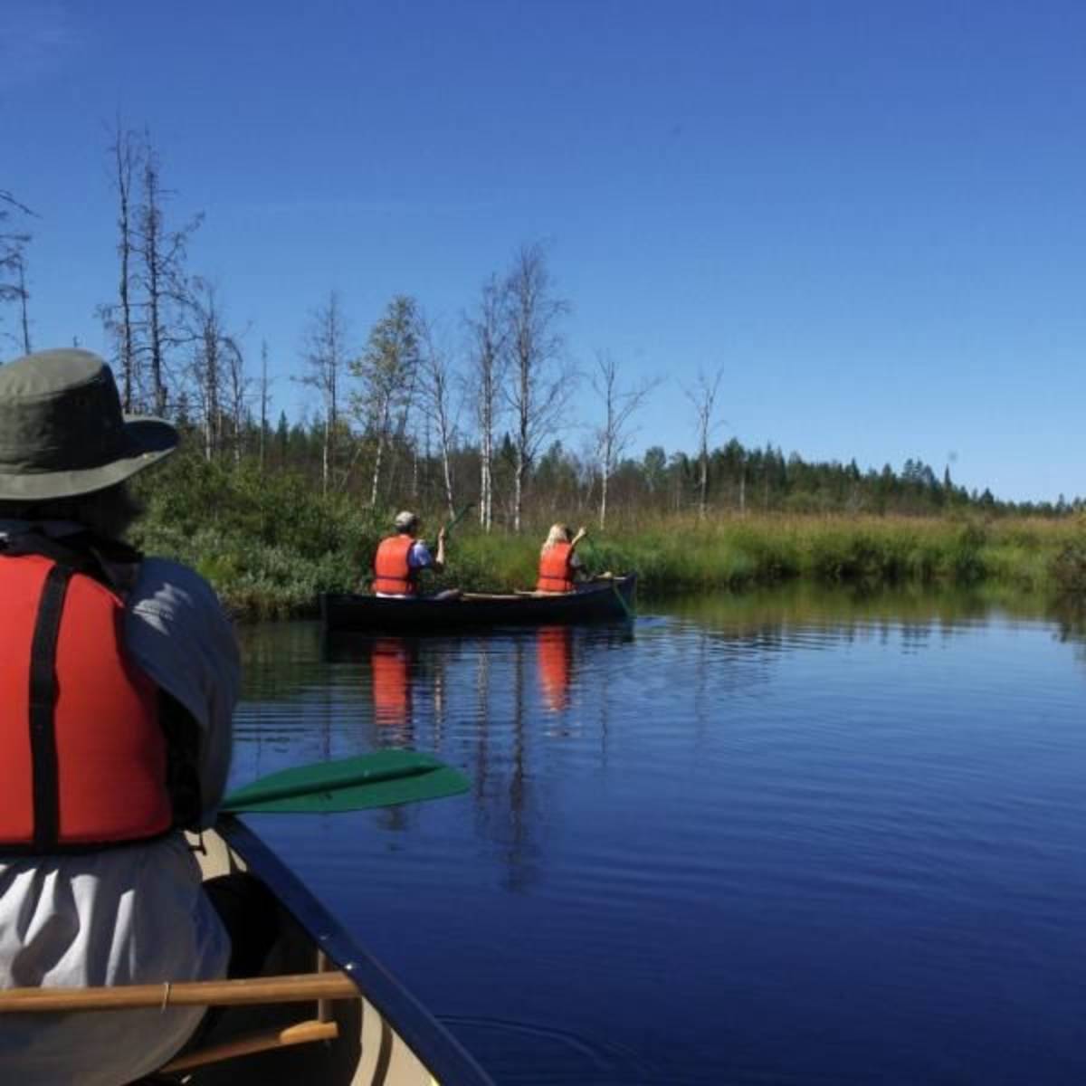 volunteer canoeing on the river