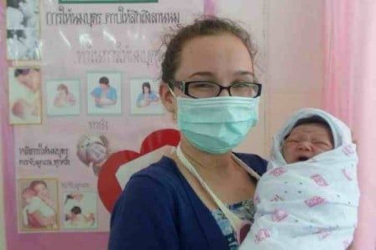 An image of a student holding the baby