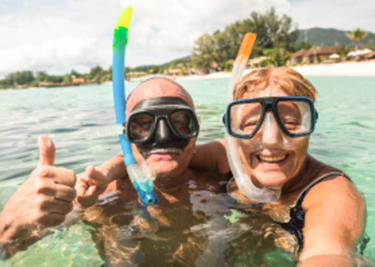 A couple of tourist snorkelling on a beautiful day.