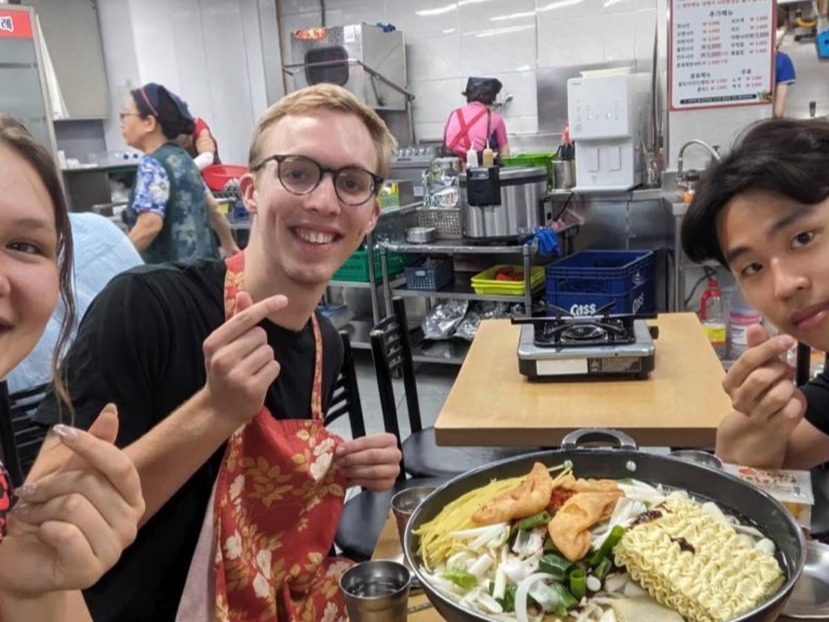 A group of friends eating at Tteokbokki Restraunt in Seoul.