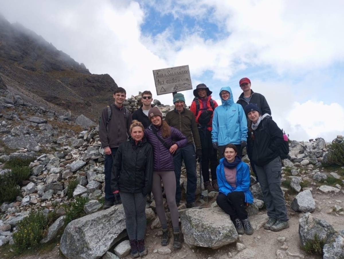 a group of hikers pose for a photo
