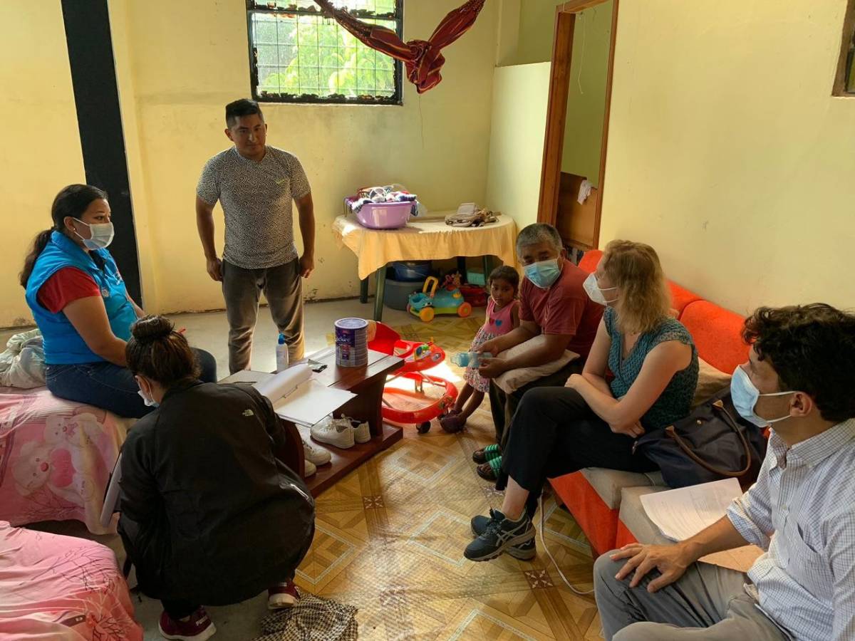A group of patients and doctors in home.