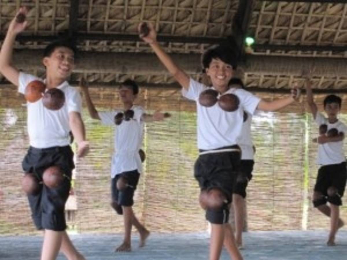A group of young boys performing a synchronized dance.