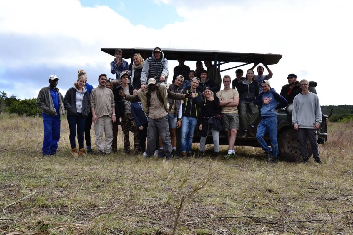 a group poses for a photo on the range