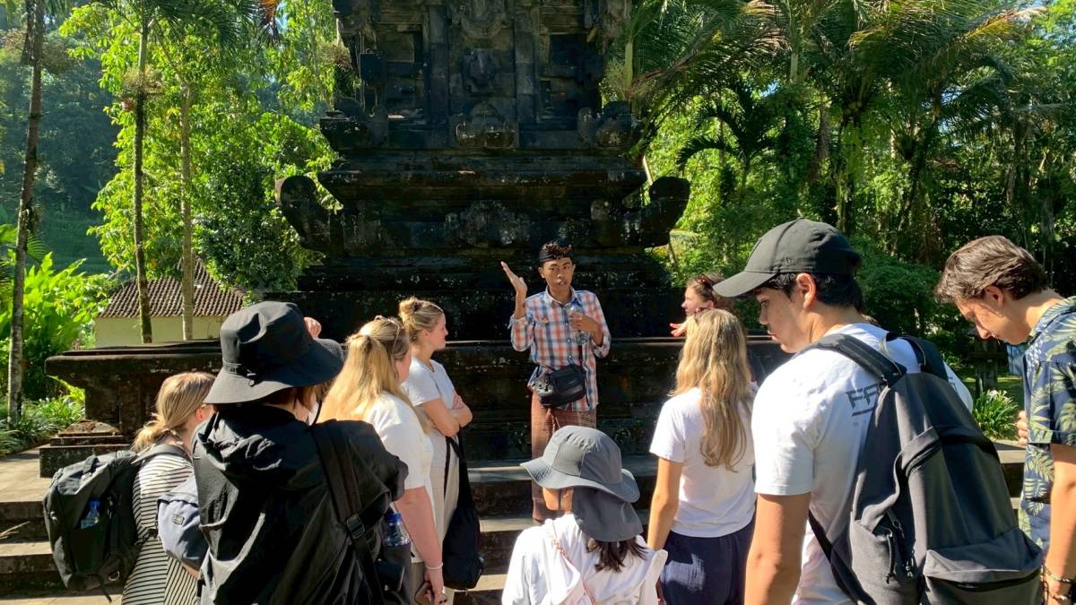 a guide giving a tour at a temple
