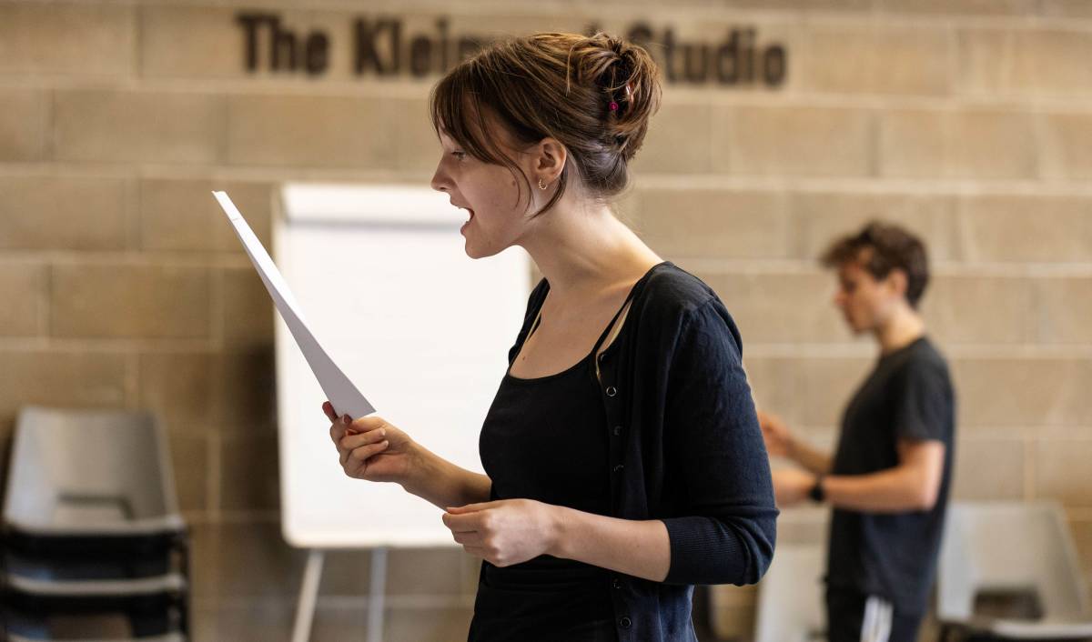 A LAMDA Summer School student holding a script