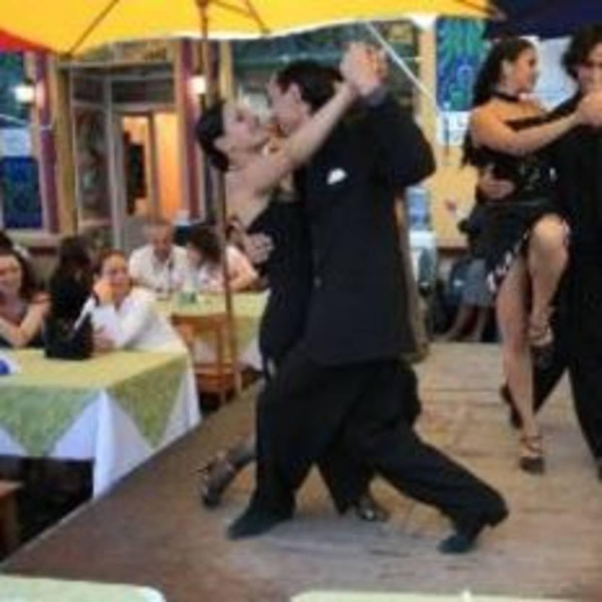 A lively group dancing in a restaurant.