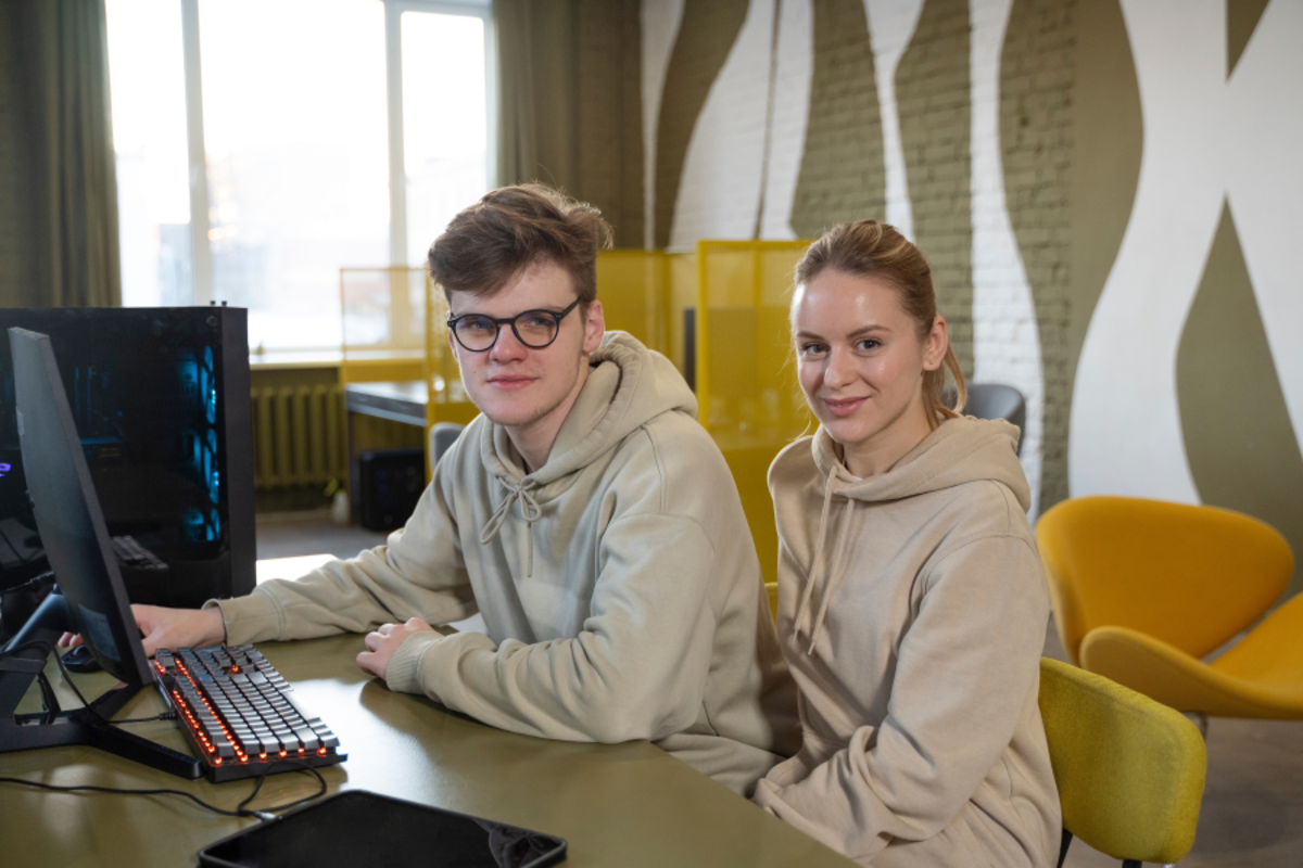 a man and woman collaborating in a modern workspace