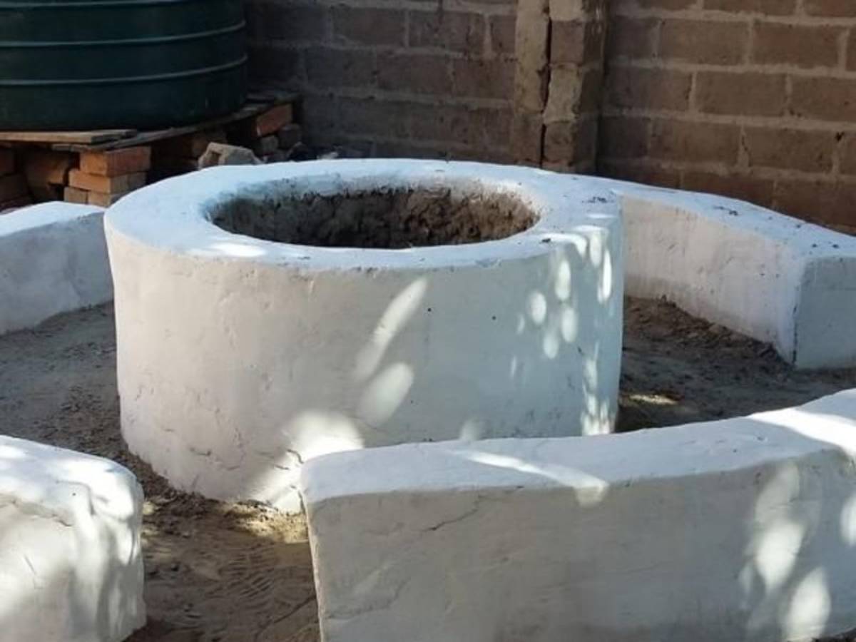 a newly painted white well
