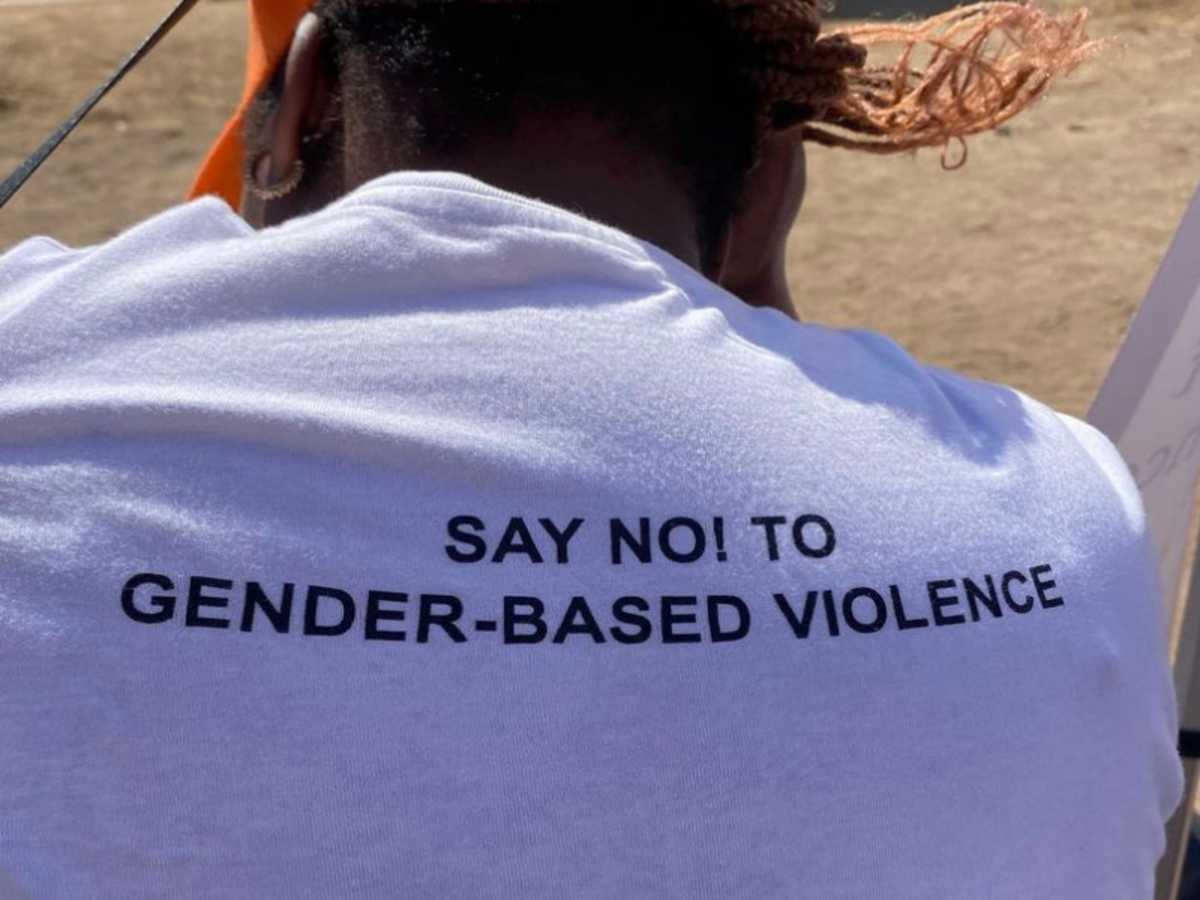 A photo of the back of a white t-shirt, which reads "Say No! To gender-based violence".