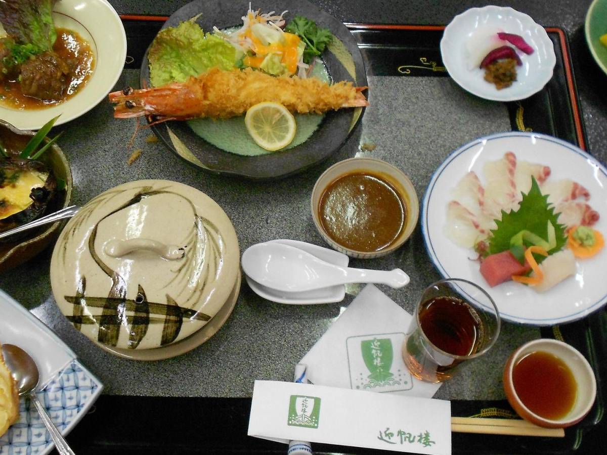 A tray with several plates of traditional cuisine in Japan.