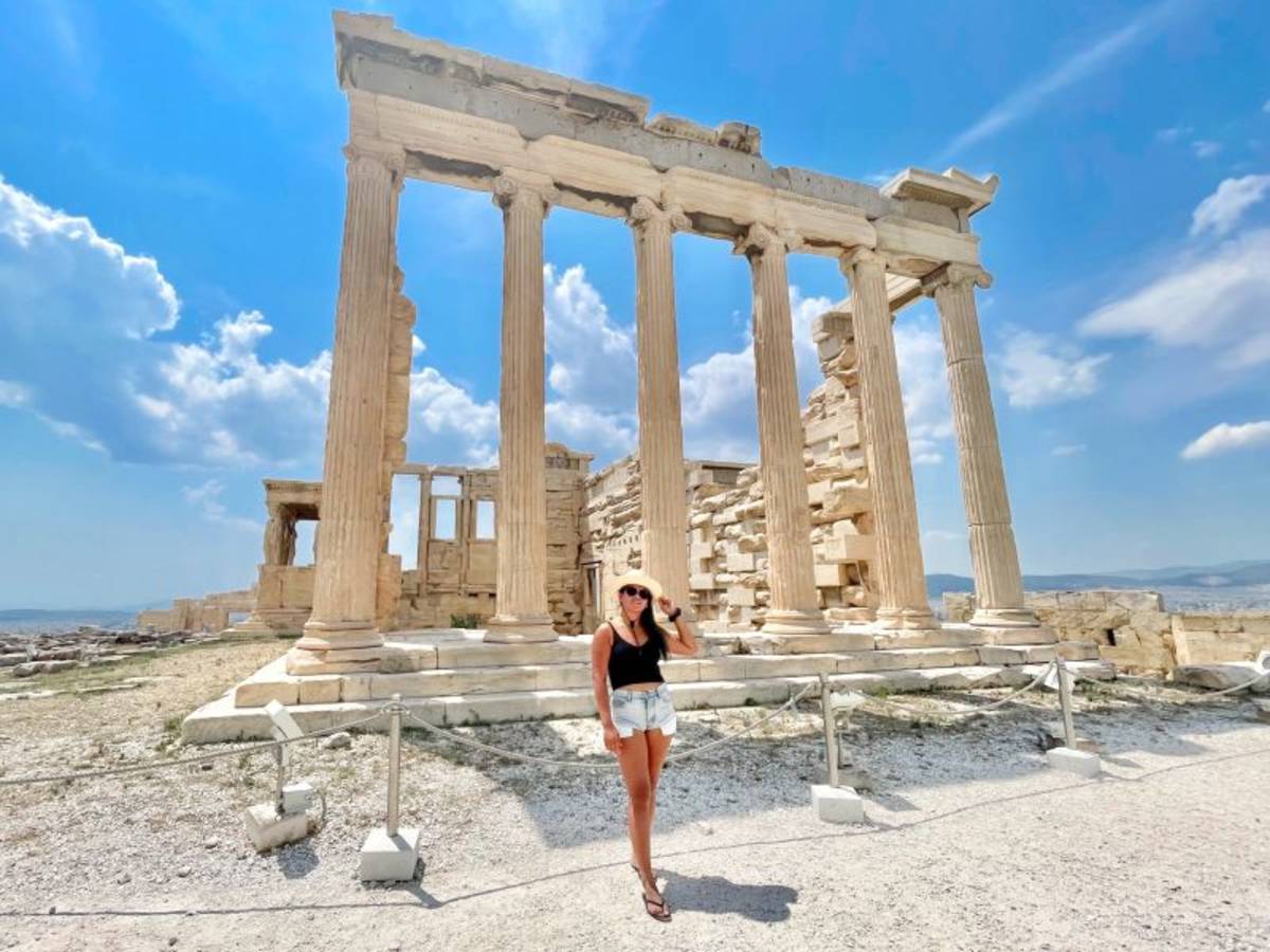 a woman by the doric columns