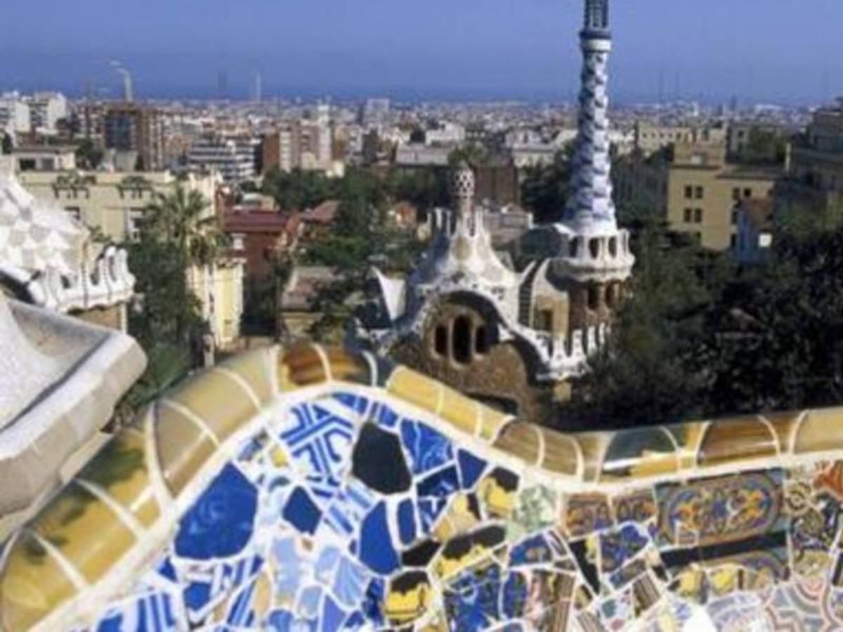 Aerial view of Barcelona, Spain showcasing the city's unique architecture, vibrant streets, and beautiful coastline.