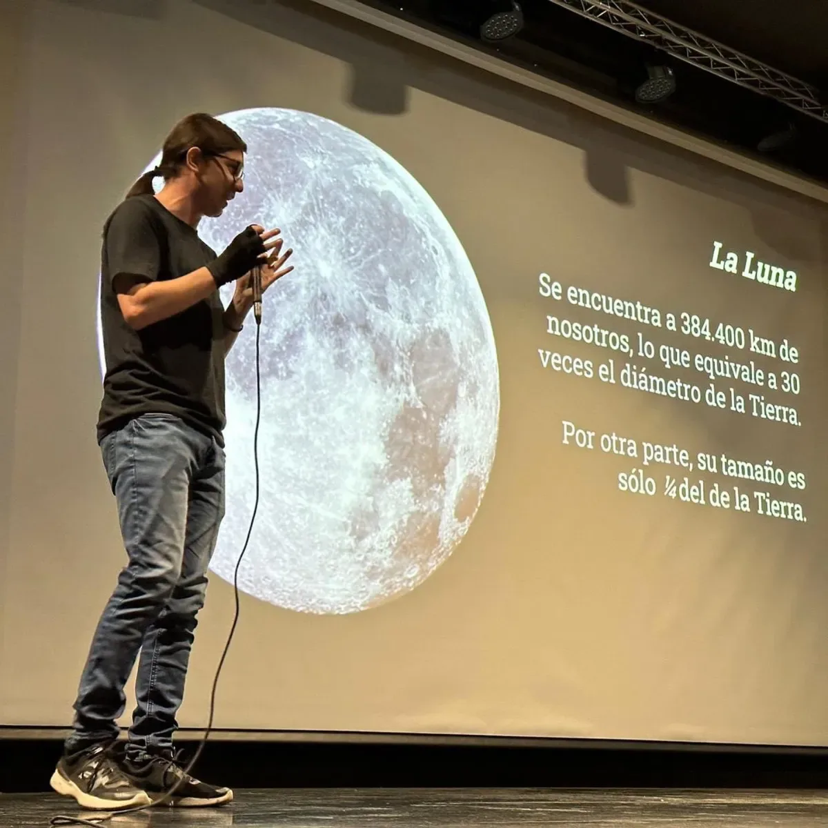 Astronomy instructor giving a lecture on astrophysics concepts to students during the Astronomy Observation and Research Program in Chile.